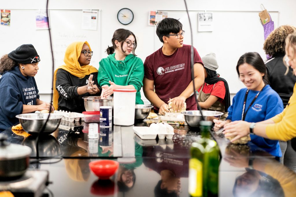 Students cook together in the Food Lab.